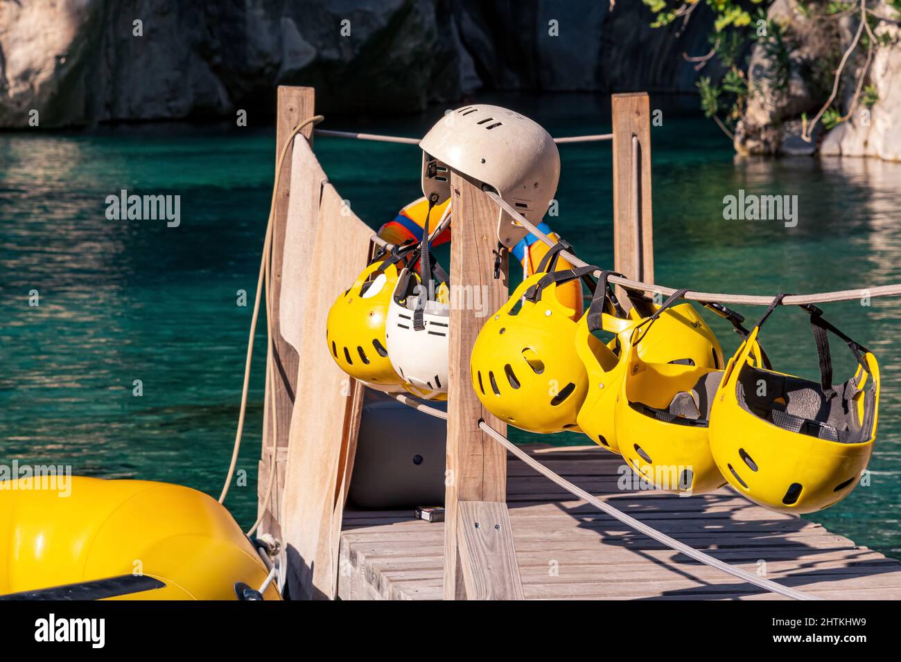 Pier for rafting with folded equipment - helmets and moored raft ...