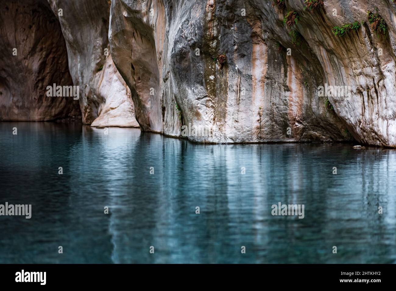 clear blue water in a deep canyon with sheer rock walls Stock Photo - Alamy