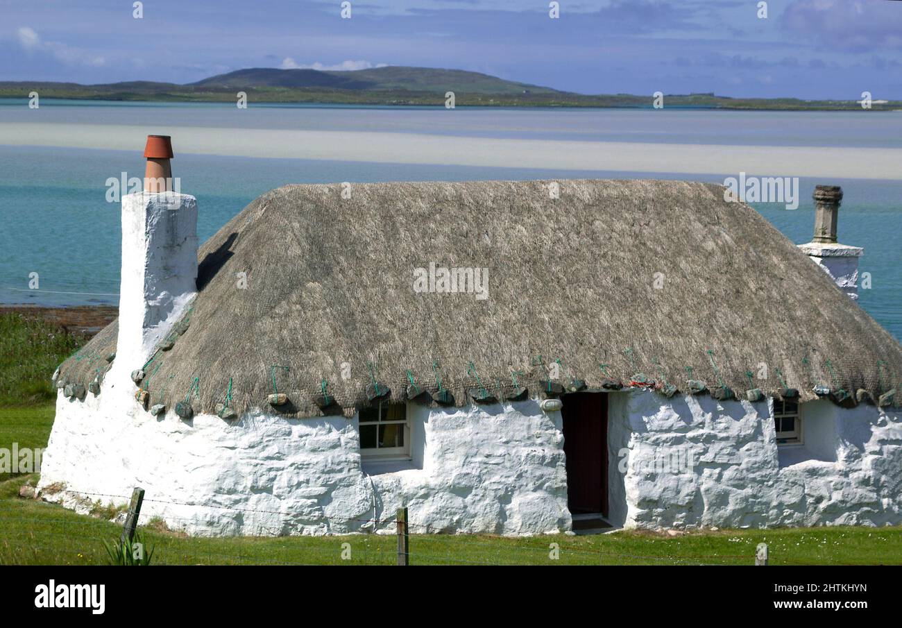 Traditional croft  thatched cottage at Malacleit on the Outer Hebrides island of North Uist, Scotland, UK Stock Photo