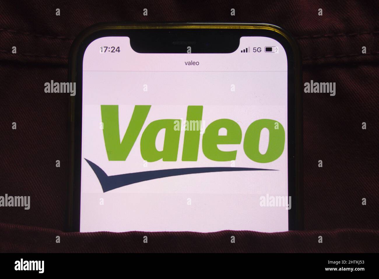 KONSKIE, POLAND - February 27, 2022: Valeo SA logo displayed on mobile phone hidden in jeans pocket Stock Photo