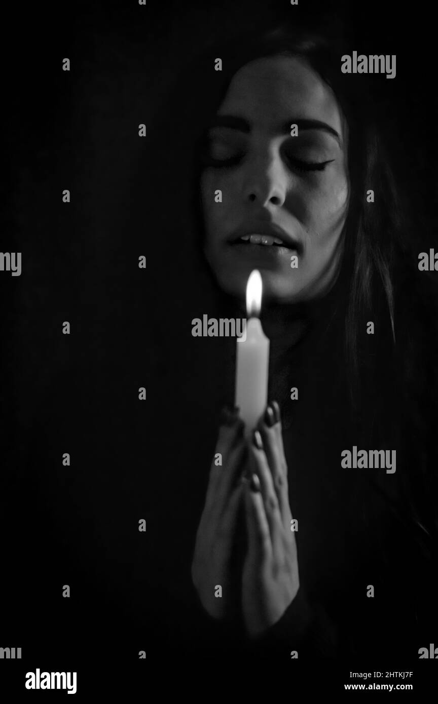 Black and white portrait of a beautiful young woman with long hair