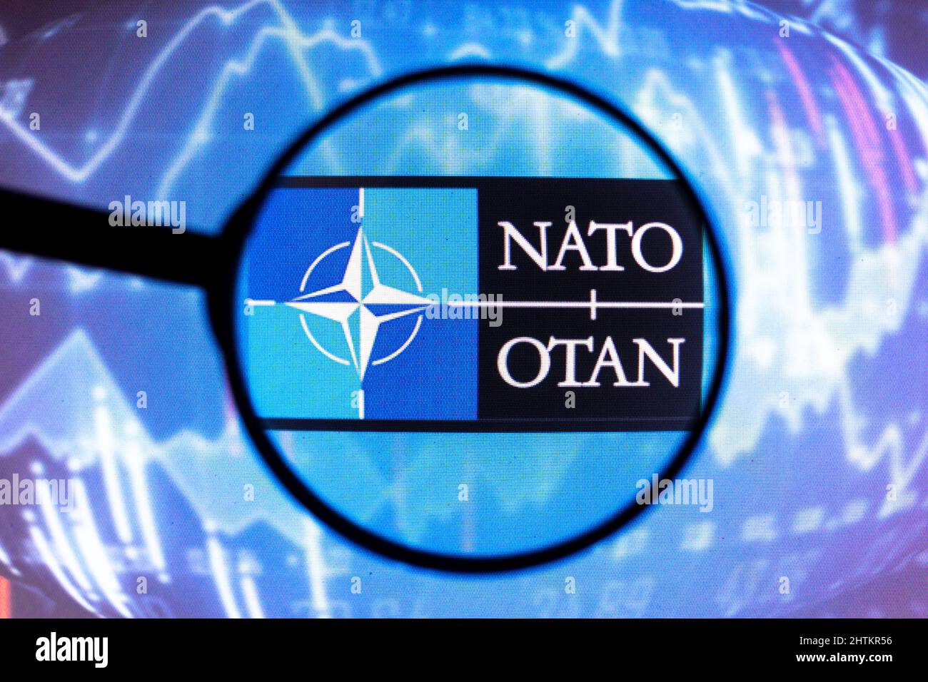 Brazil. 01st Mar, 2022. In this photo illustration, a North Atlantic Treaty Organization (NATO) logo seen displayed on a computer screen through a magnifying glass. Credit: SOPA Images Limited/Alamy Live News Stock Photo