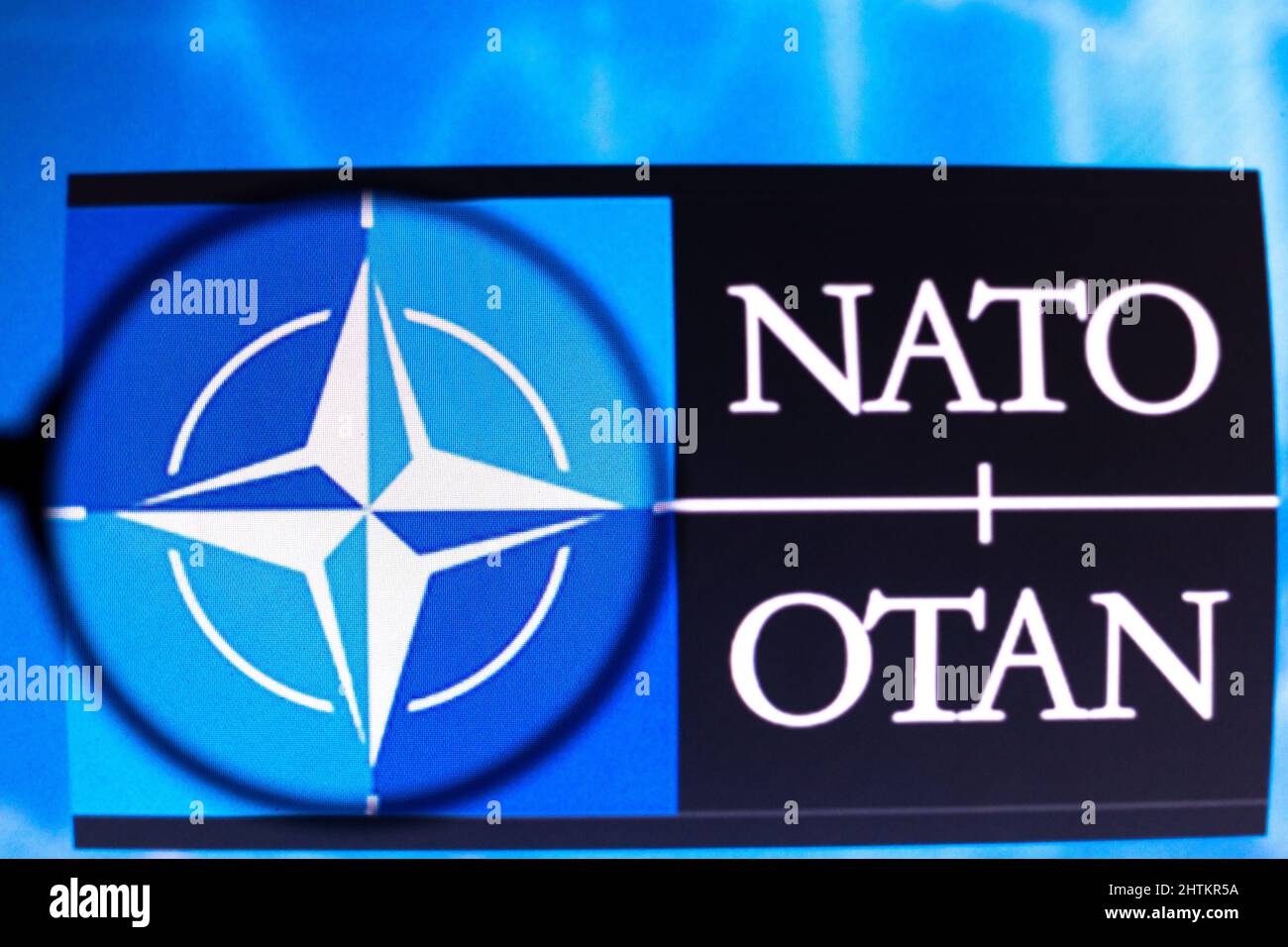 Brazil. 01st Mar, 2022. In this photo illustration, a North Atlantic Treaty Organization (NATO) logo seen displayed on a computer screen through a magnifying glass. Credit: SOPA Images Limited/Alamy Live News Stock Photo