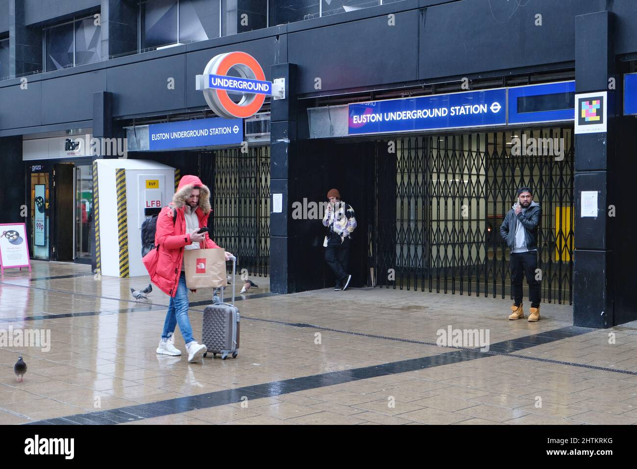 London, UK, 1st Mar, 2022. Members of the public walk past a shuttered Euston Underground Station as visitors and commuters found alternative ways to complete their journey this afternoon, on foot, via bus, taxi or cycling, amid a Tube strike affecting all services for 24 hours. The strike called by the RMT Union over threats of 600 job losses and pension cuts saw 10,000 staff stage a walkout. Credit: Eleventh Hour Photography/Alamy Live News Stock Photo