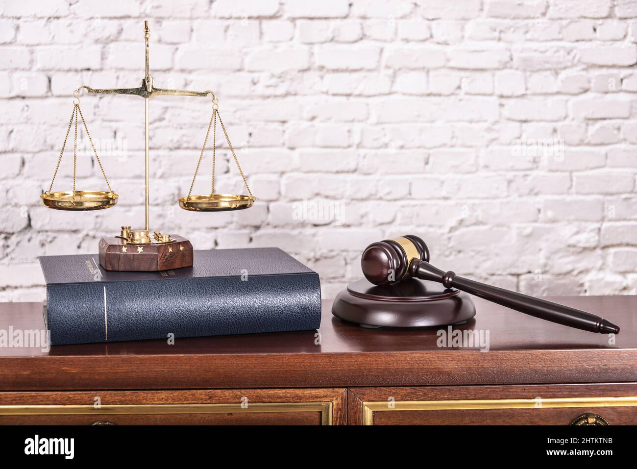Scales of justice with law books on table of notary public in office ...