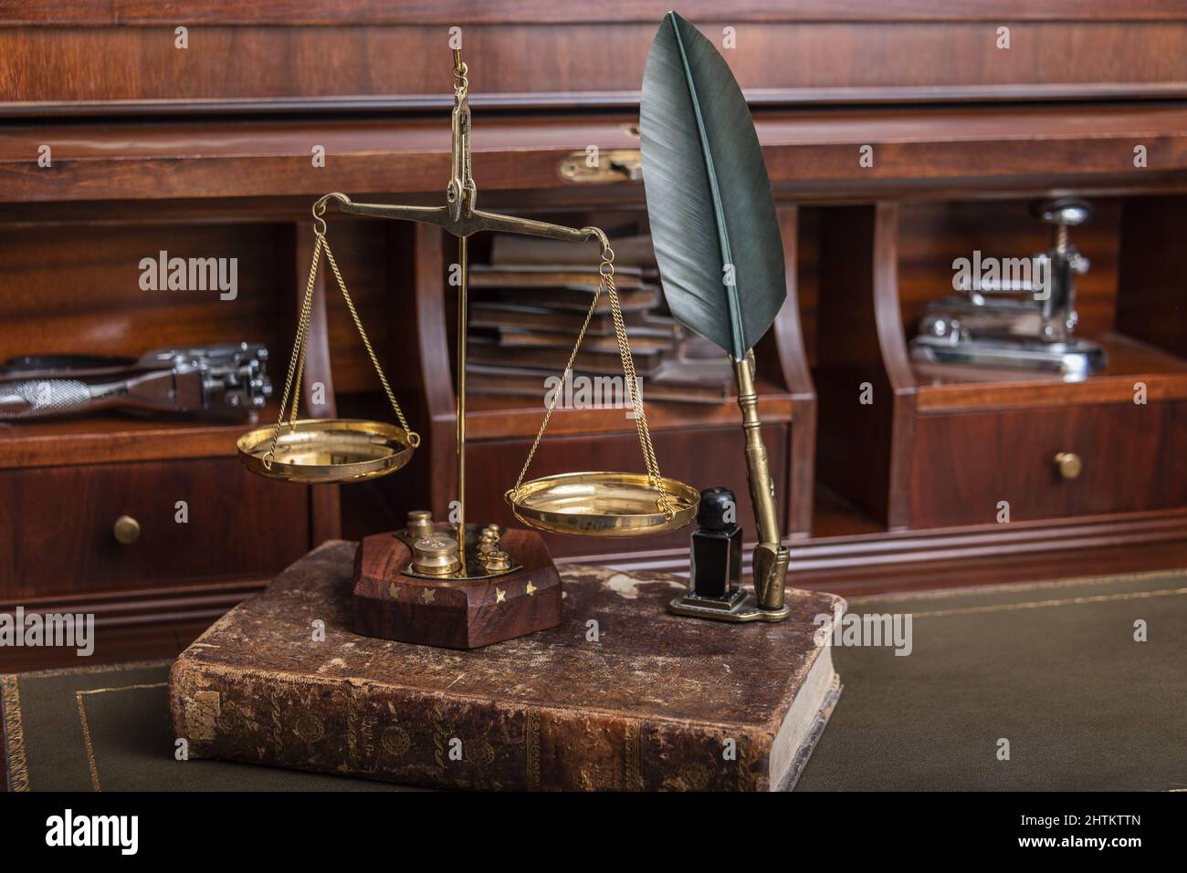 Notry Scale Scales of justice with law books on table of notary public in office ...