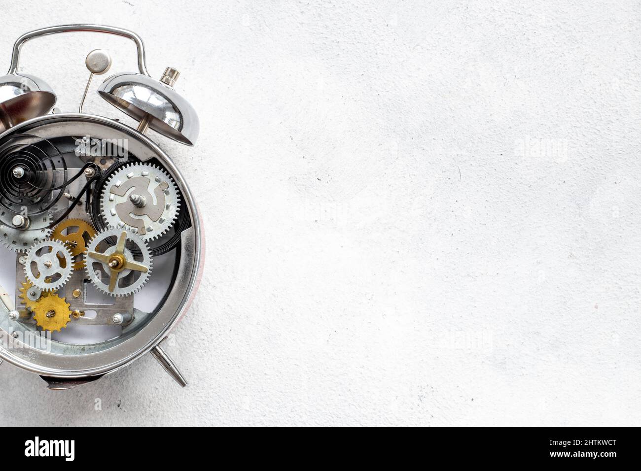 Watch mechanism with gears and wheels close up. Alarm clock mechanism