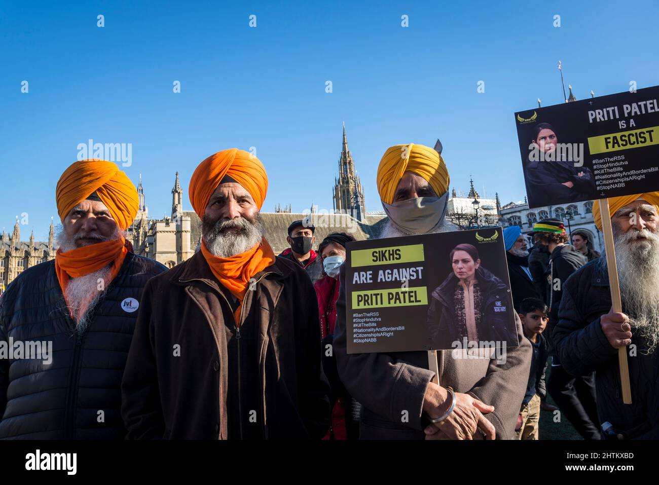 Sikh Protestors holding placards against Priti Patel and the Nationality and Borders Bill, Parliament Square, London, UK, 27th February 2022 Stock Photo