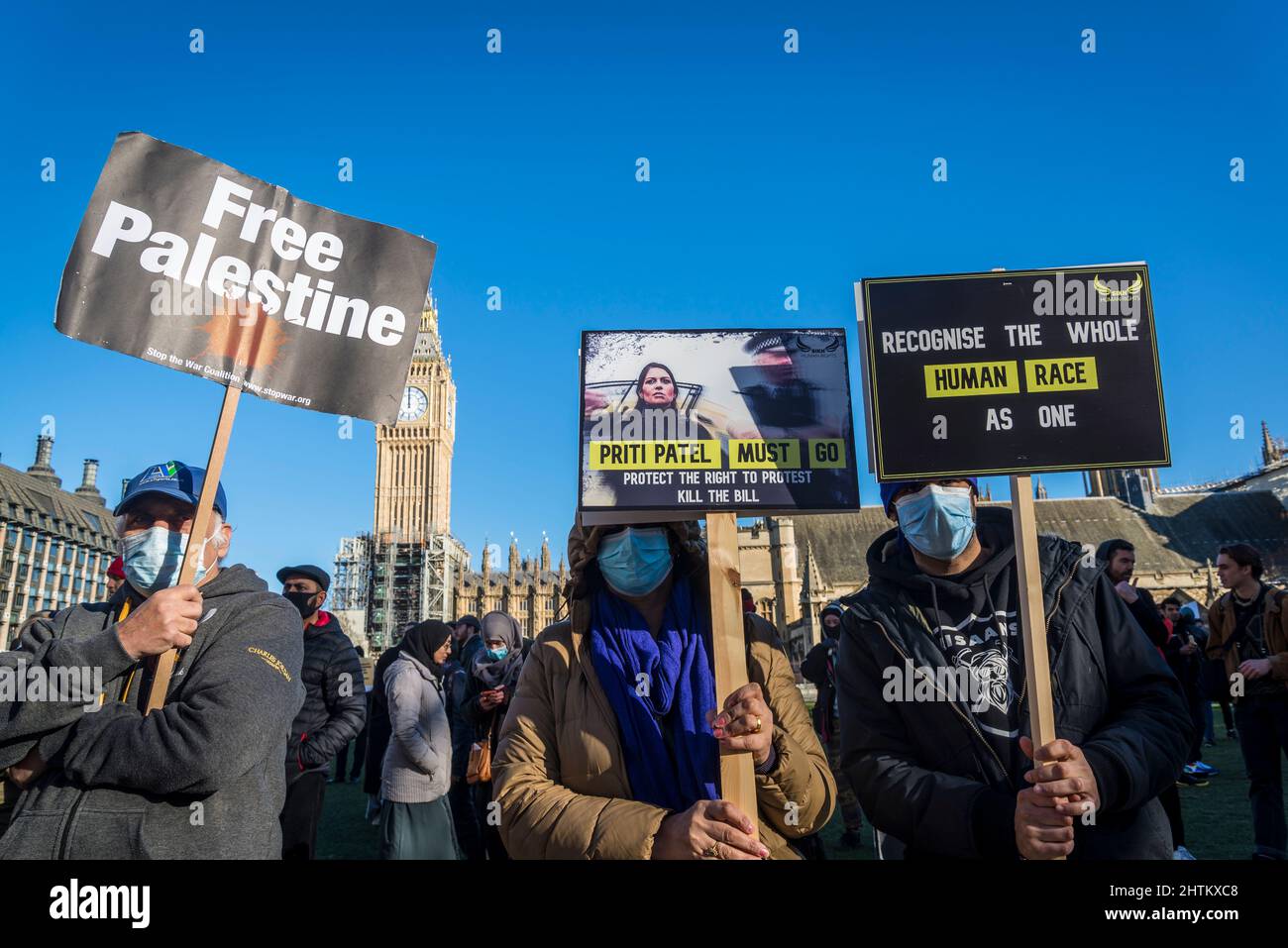 Protestors holding placards against Priti Patel and the Nationality and Borders Bill, Parliament Square, London, UK, 27th February 2022 Stock Photo