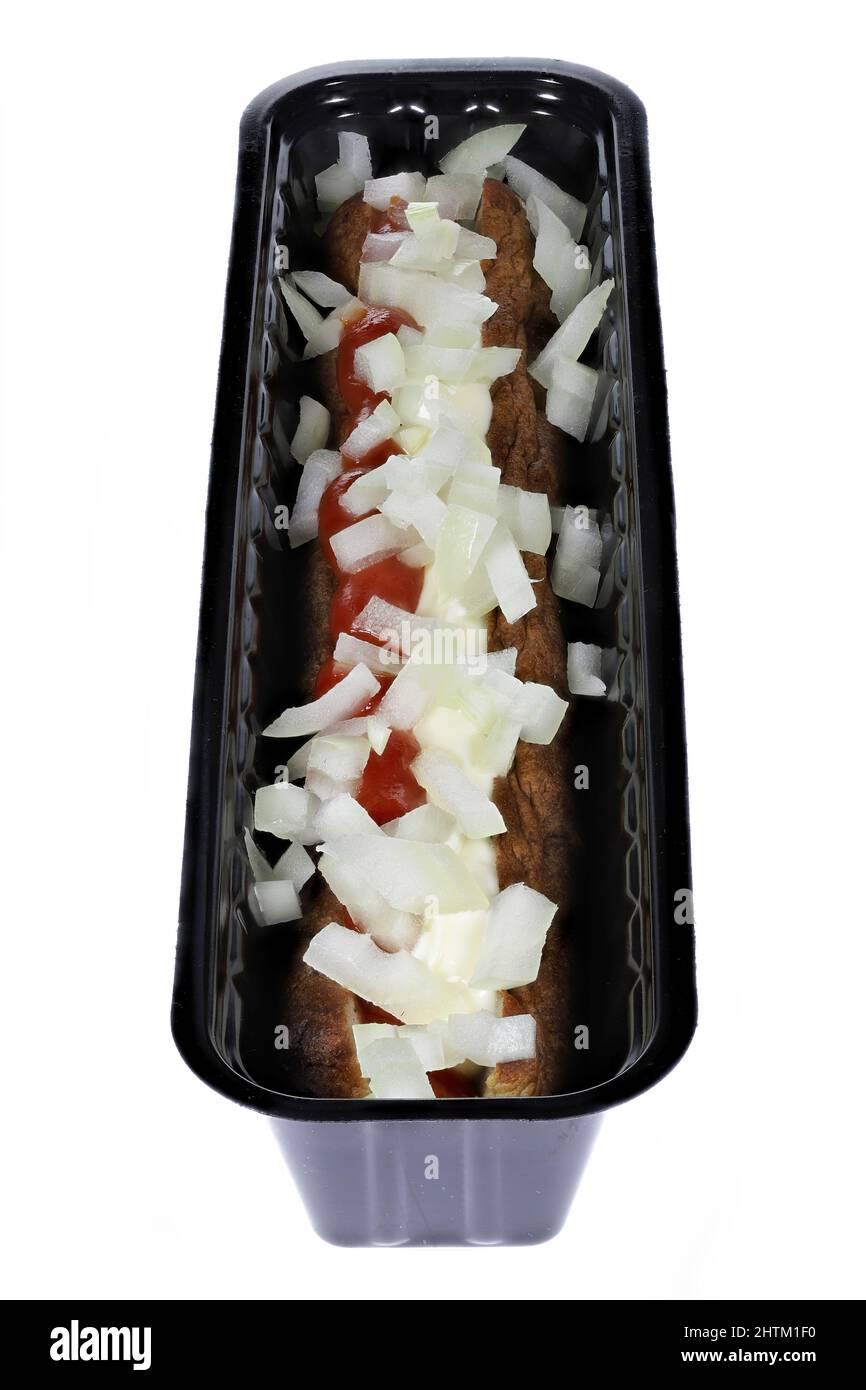 Dutch frikandel speciaal in a black plastic container isolated on white background Stock Photo