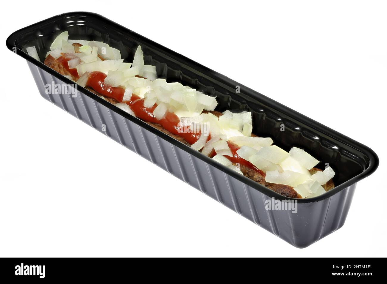 Dutch frikandel speciaal in a black plastic container isolated on white background Stock Photo