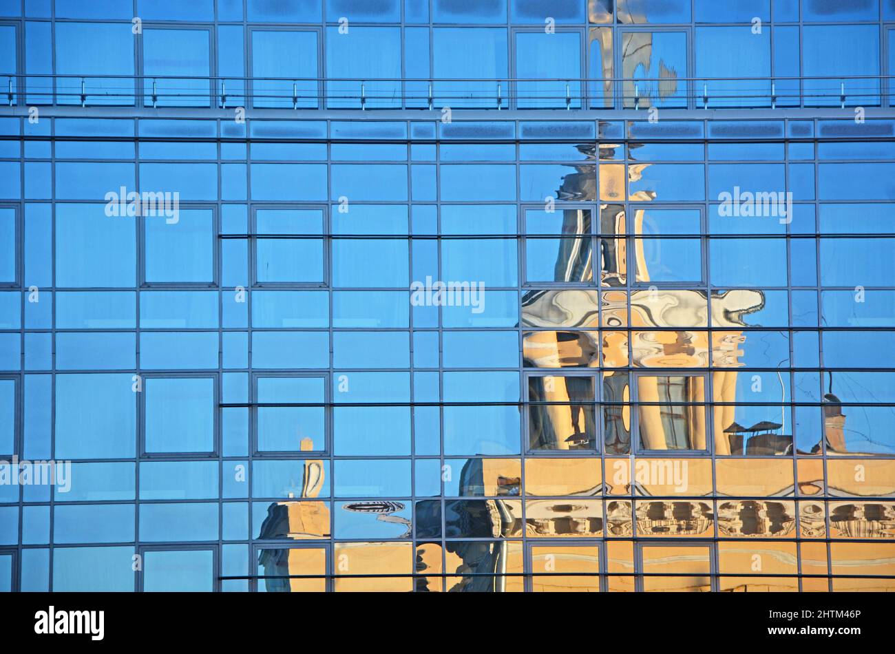 Railroad station reflecting in hotel glass wall. Karelia Republic, Petrozavodsk, Russia Stock Photo