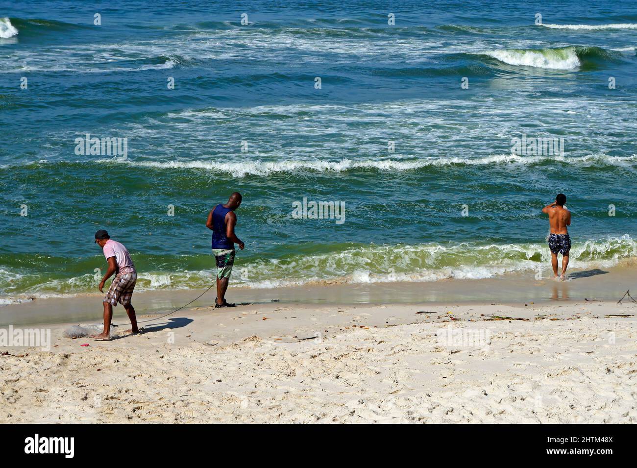 Fishermen at Barra da Tijuca beach, Rio Stock Photo