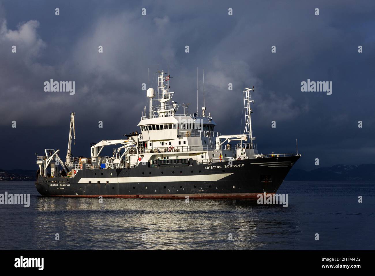 Ocean research vessel Kristine Bonnevie at Byfjorden, arriving near the port of Bergen, Norway. Owned by the University of Bergen, Institute of Marine Stock Photo