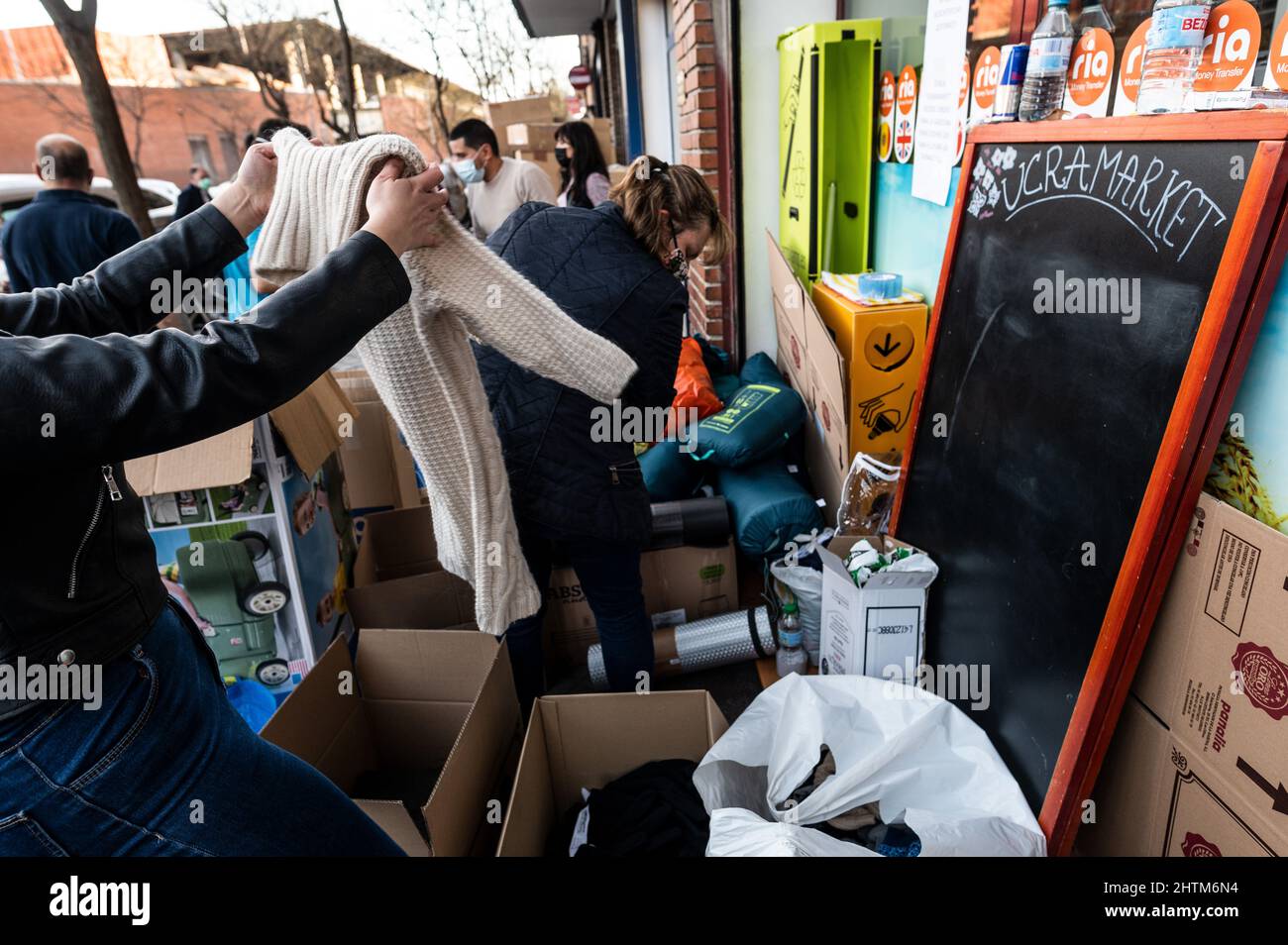 Madrid, Spain. 01st Mar, 2022. People organizing aid material for sending to Ukraine. The Ukrainian shop Ucramarket has become a center for receiving donations to send to Ukraine, receiving medicines, food, winter clothes and first aid kits. Credit: Marcos del Mazo/Alamy Live News Stock Photo