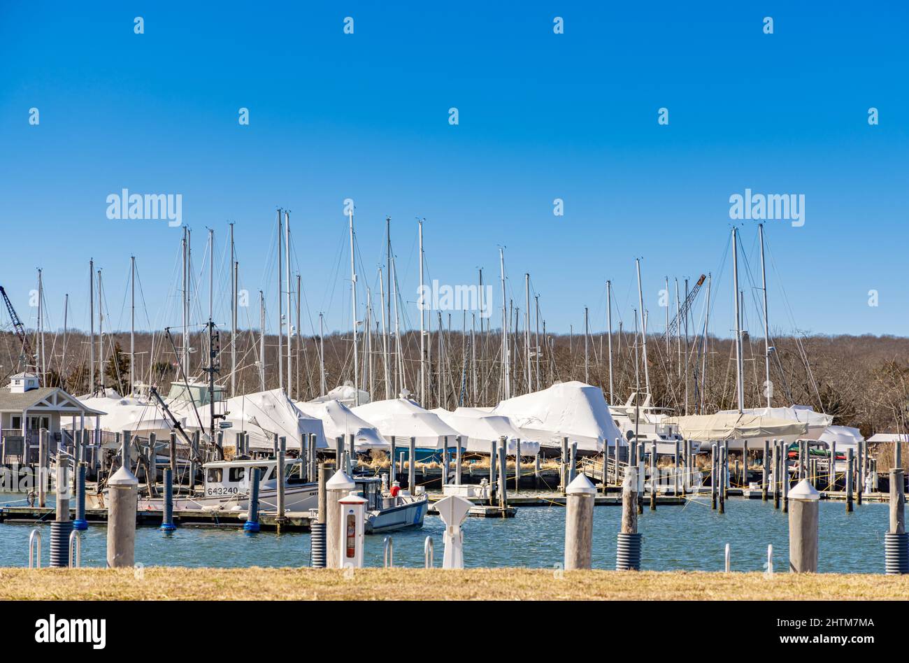 Many winterized sail boats at Three Mile Harbor Marina Stock Photo