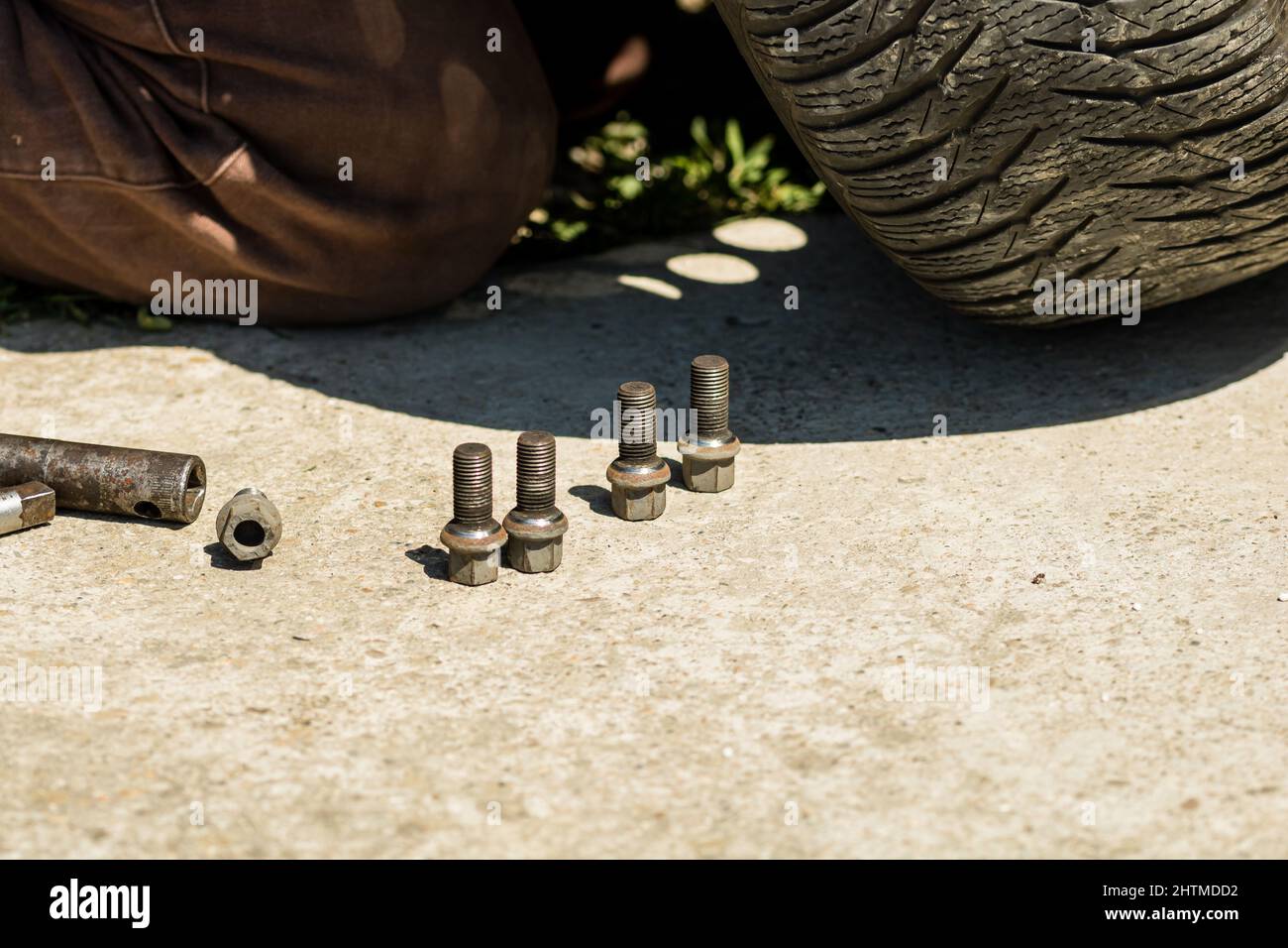 Wheel bolts and wrench for wheel changing in a garage in Targoviste