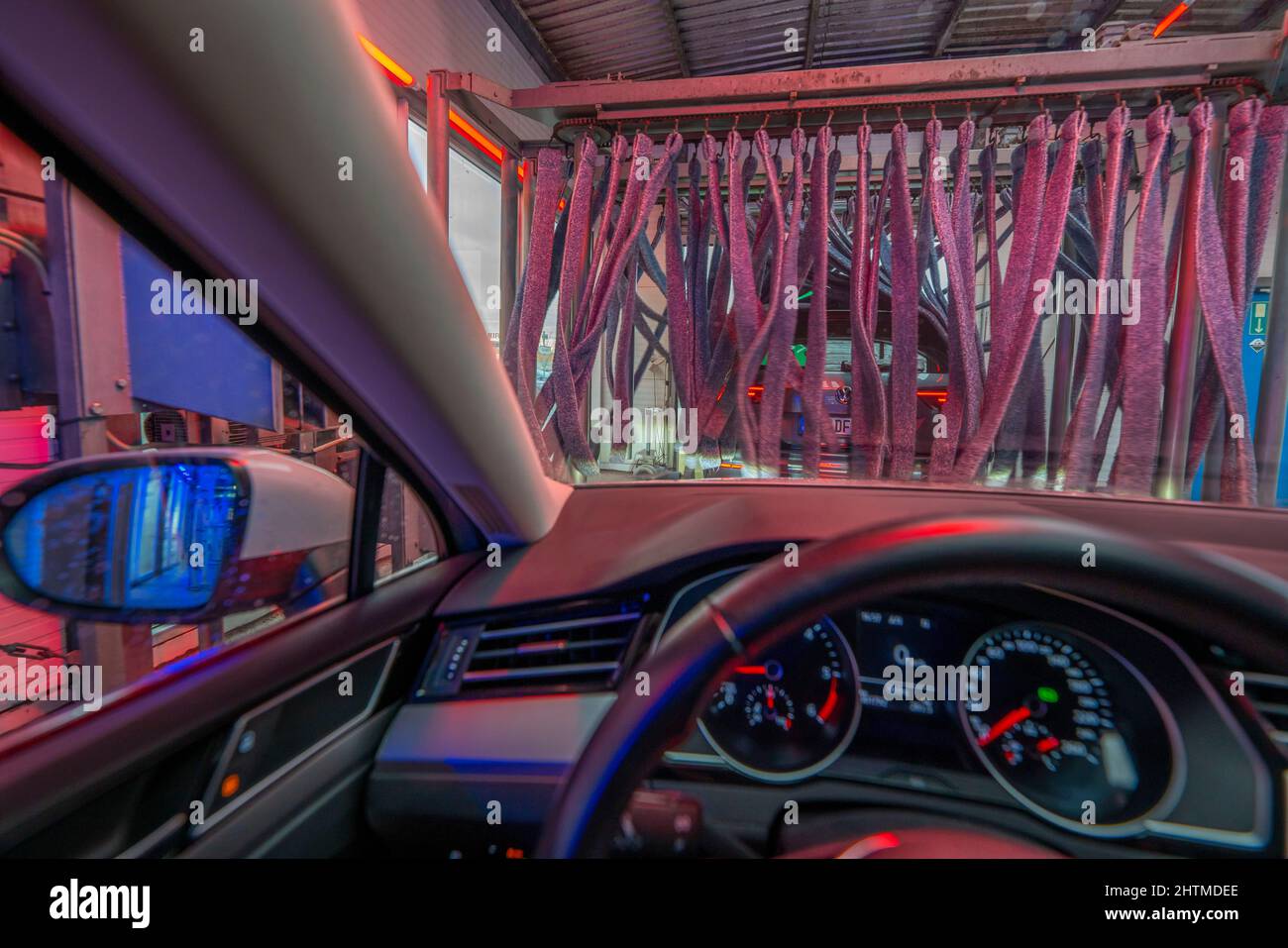 Car in an automatic car wash, car wash line, vehicle drying after