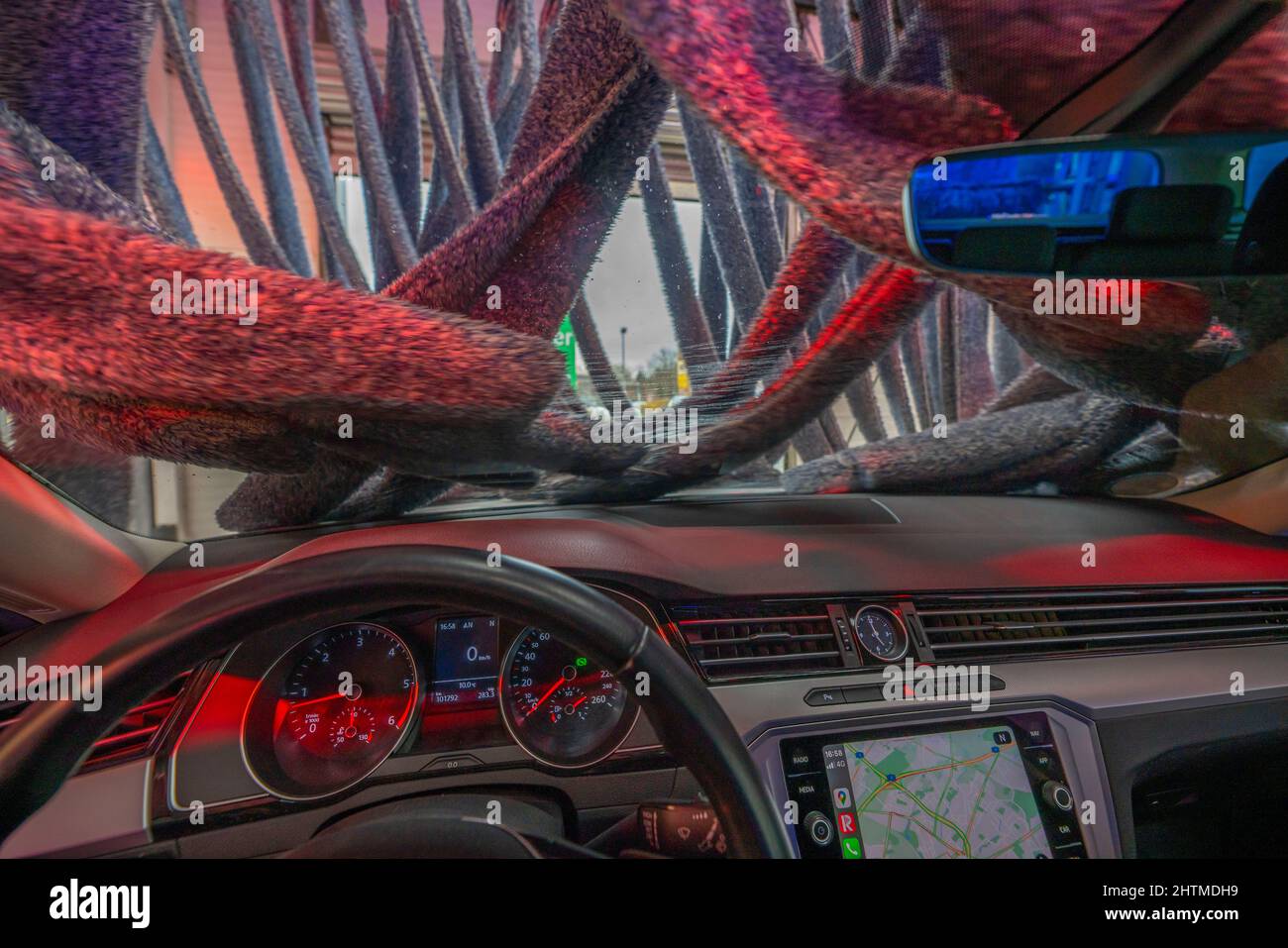 Car in an automatic car wash, car wash line, vehicle drying after