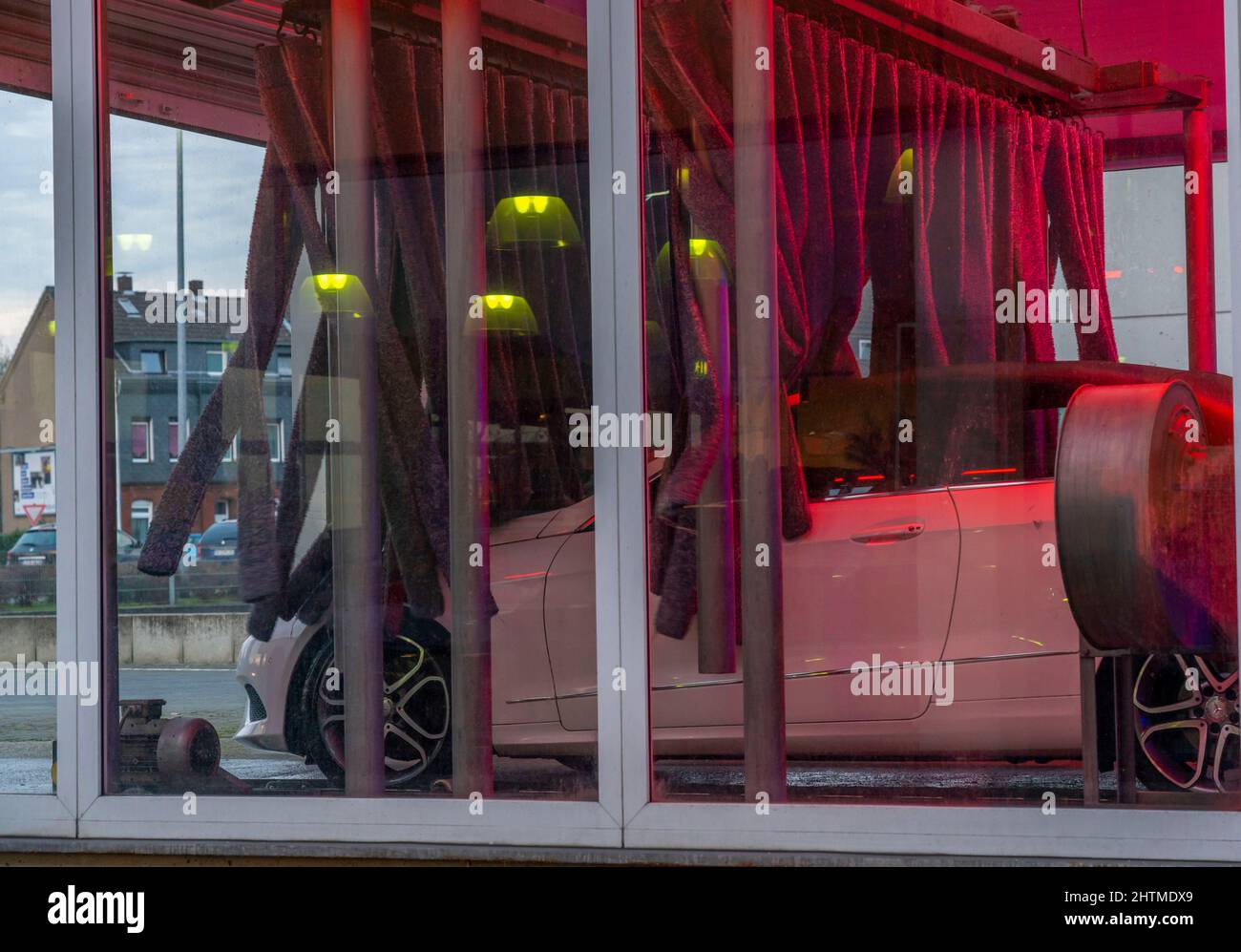 Car in an automatic car wash, car wash line, vehicle drying after