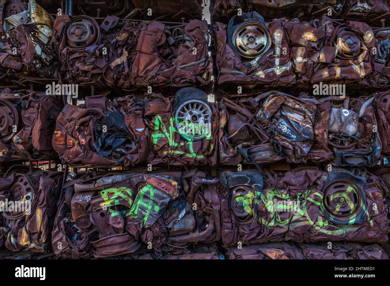 A wall of crushed, compacted cars. Perhaps a useful conceptual