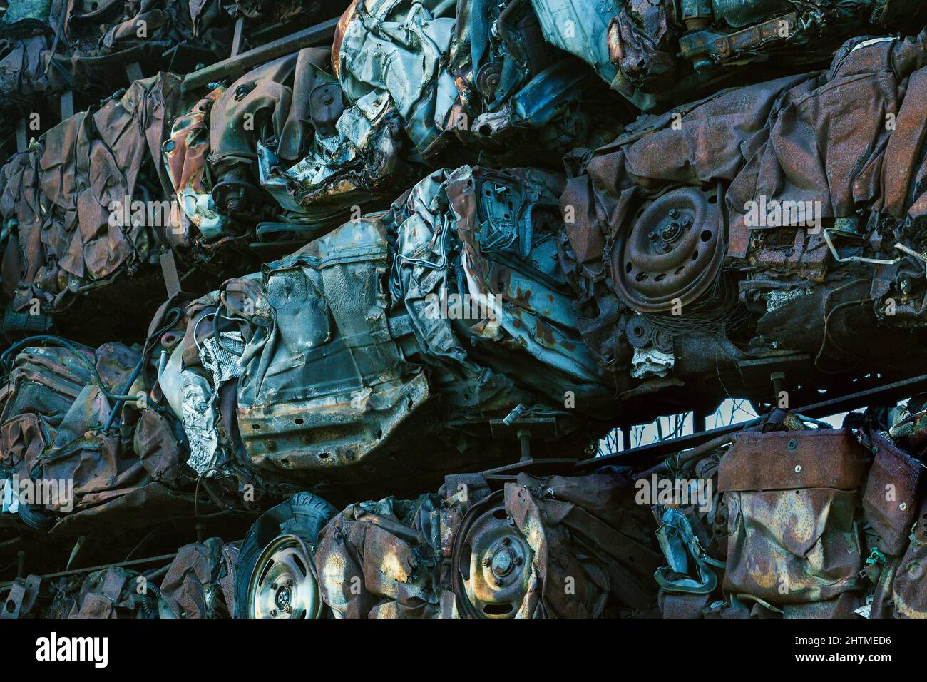 A wall of crushed, compacted cars. Perhaps a useful conceptual representation of environmental pollution issues. Stock Photo