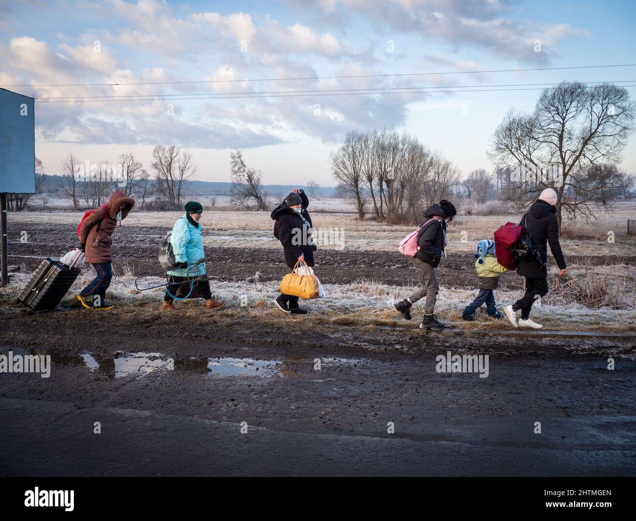 Yavoriv, Ukraine. 26th Feb, 2022. Refugees seen having to give up their mode of transportation and walk to the Polish border on foot as the wait for vehicles to cross the border is estimated to take days.At dawn of 24 February 2022, Russia launched a full-scale invasion to Ukraine. Civilian homes and hospitals have been destroyed by the Russian military action which caused many people to become homeless. (Credit Image: © Jana Cavojska/SOPA Images via ZUMA Press Wire) Stock Photo