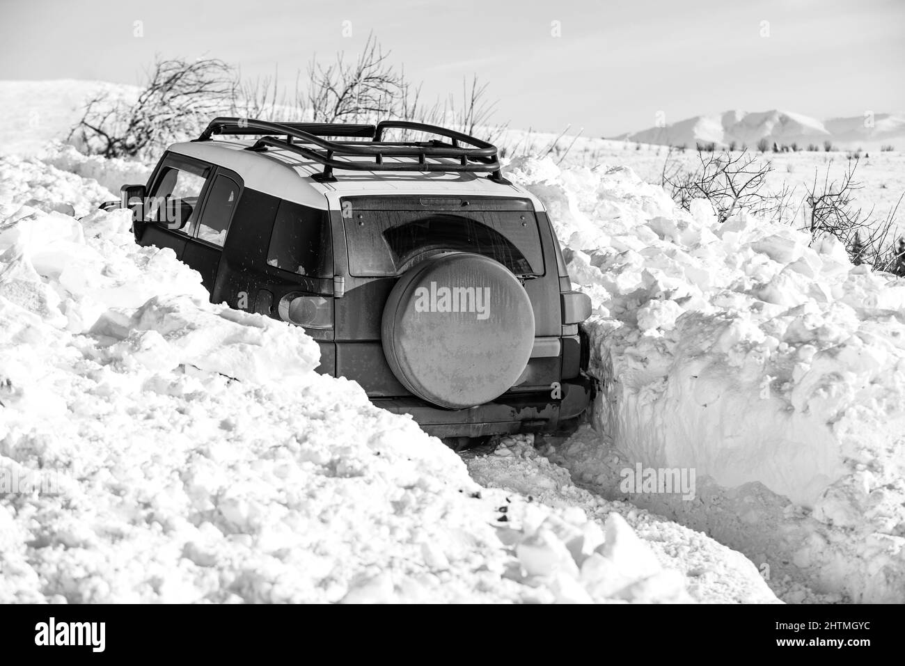 Winter offroad. Jeep in snow snowfall. Off road Adventure. Stock Photo