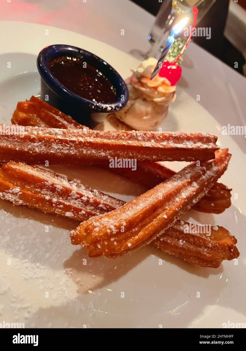 Birthday Dessert of Churros and Chocolate Sauce Served at an Upscale Mexican Restaurant, NYC, USA, 2022 Stock Photo