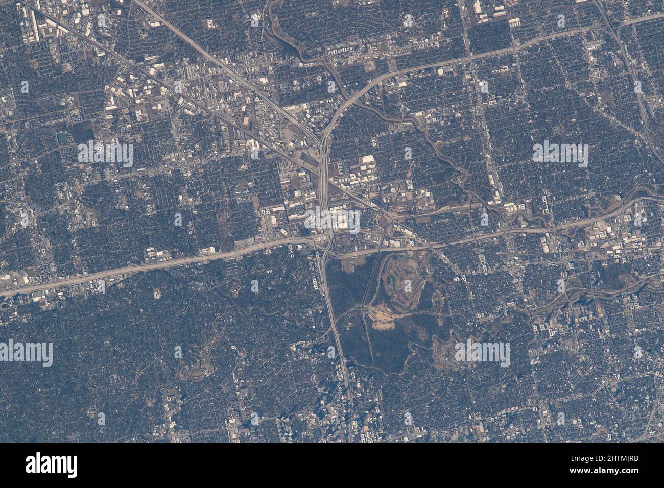 International Space Station, EARTH ORBIT. 13 February, 2022. The northwest corner of Houston, Texas, with the major highways of Interstate 610 looping around the city, Interstate 10 moving east to west, and U.S. 290 heading northwest, are pictured from the International Space Station as it orbited 258 miles above the Lone Star state, February 13, 2022 from Earth Orbit. Stock Photo