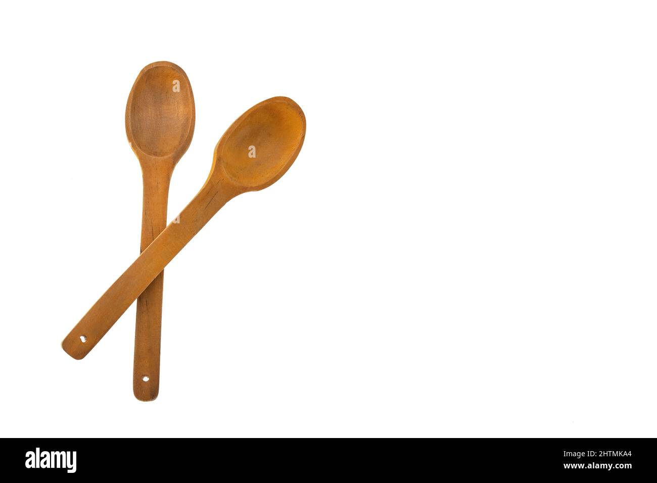 Two crossed wooden spoons White background Stock Photo Alamy