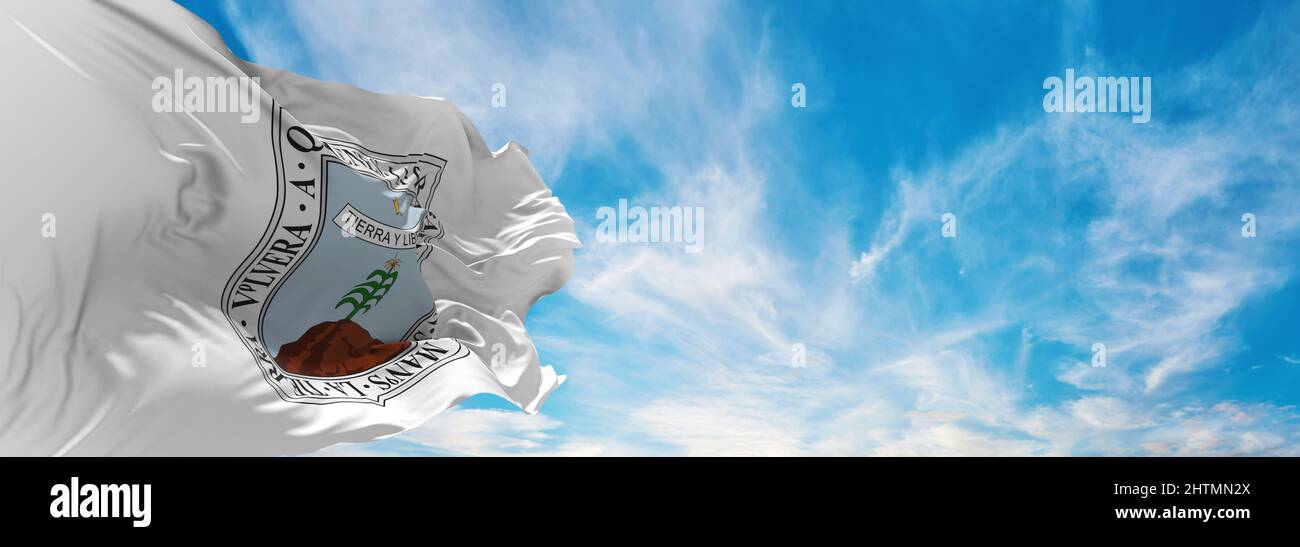 flag of Morelos , Mexico at cloudy sky background on sunset, panoramic