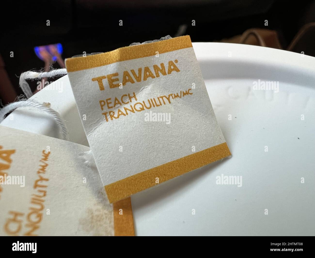 Closeup of label for Teavana Peach Tranquility atop a container of