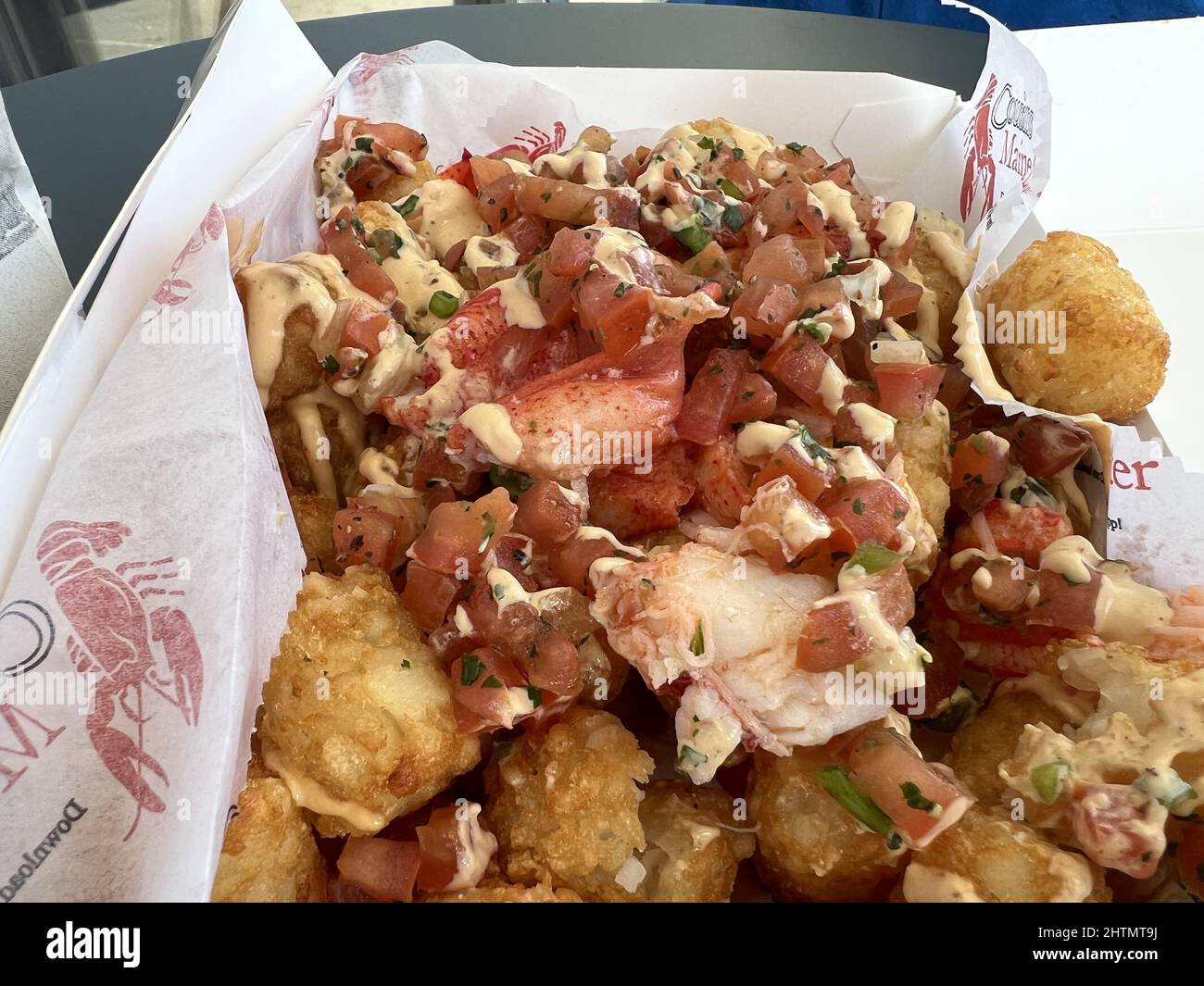 Lobster tots dish, with potato tots and chunks of lobster meat, from