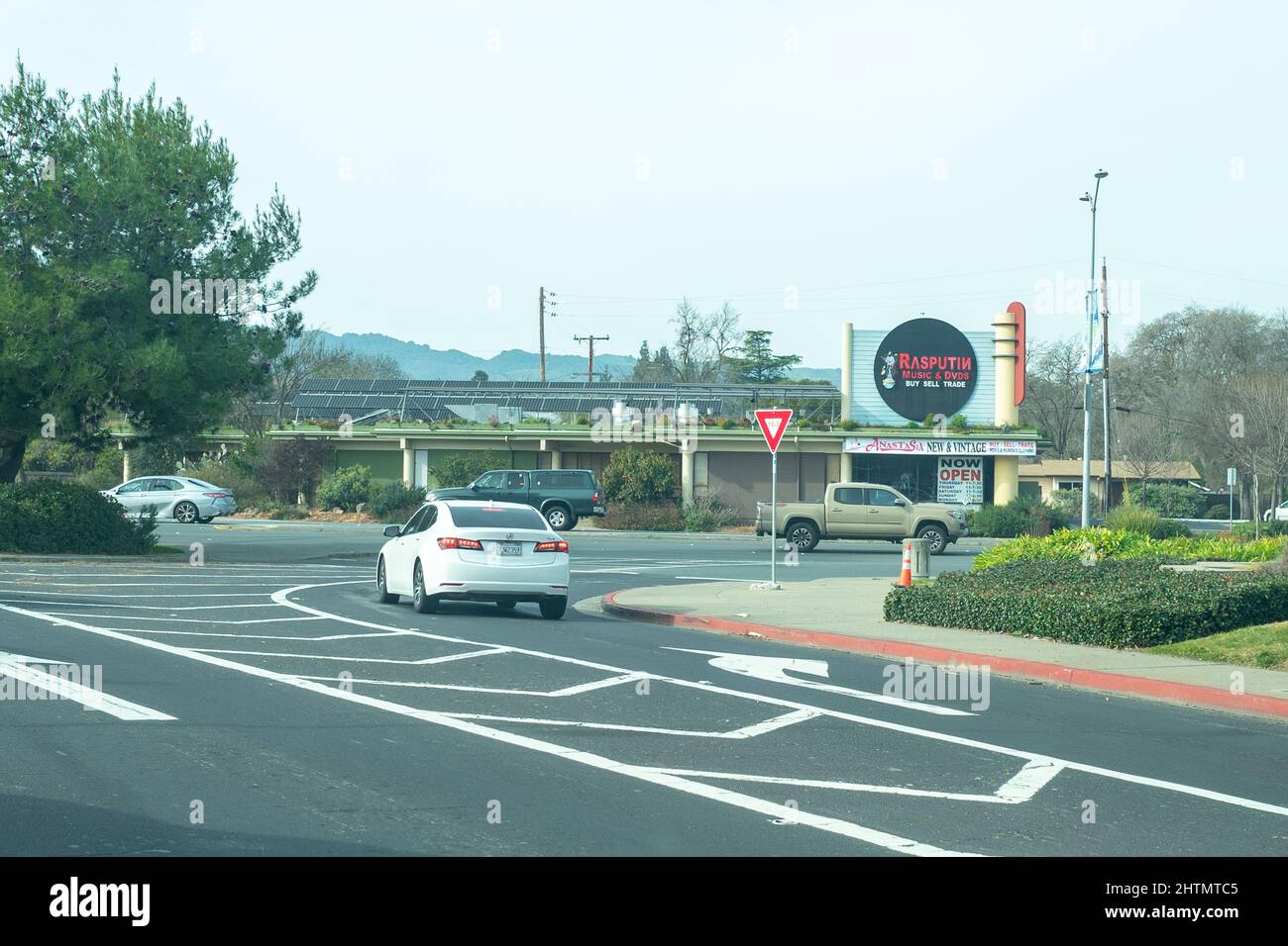 Cars drive past Rasputin Music store in Pleasant Hill, California
