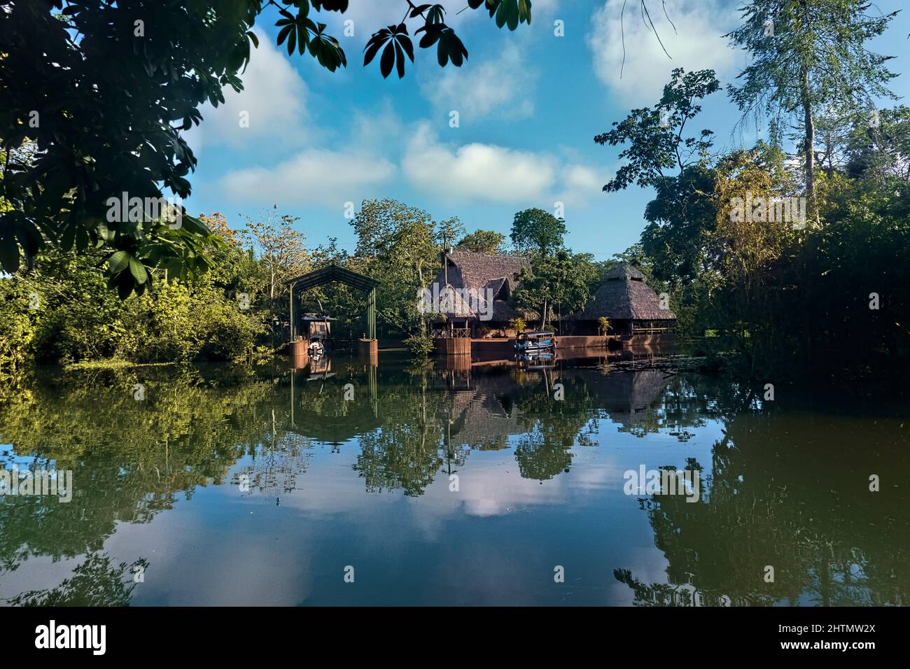 Thatch roof home on the Rio Dulce, Guatemala Stock Photo Alamy
