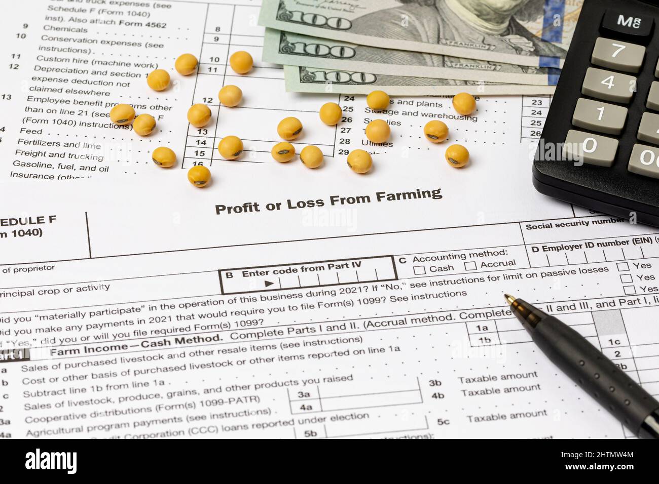 Soybeans and farm tax form. Farming income, finances and management concept. Stock Photo