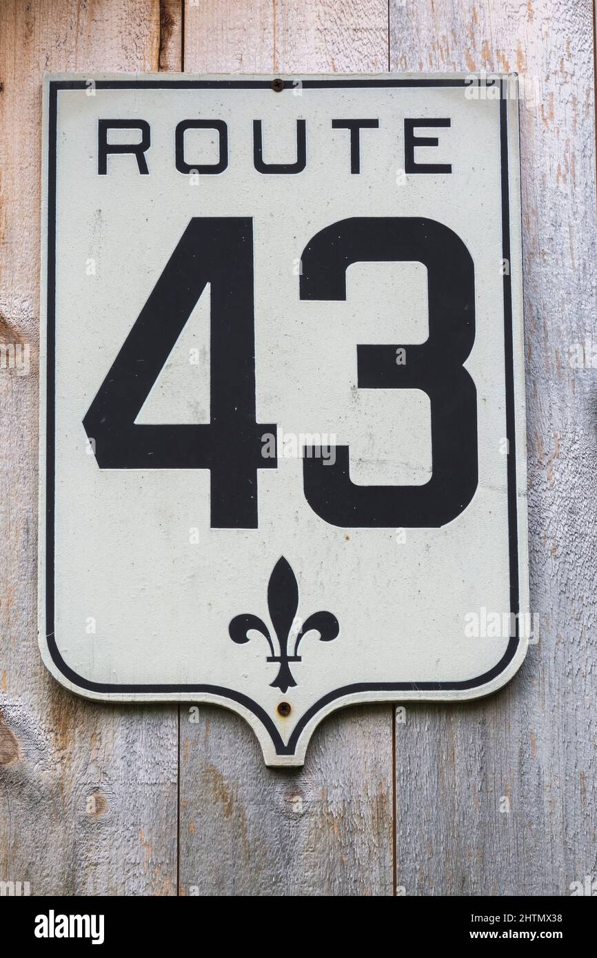 Old Quebec Provincial Route 43 highway metal sign on rustic wood plank wall. Stock Photo