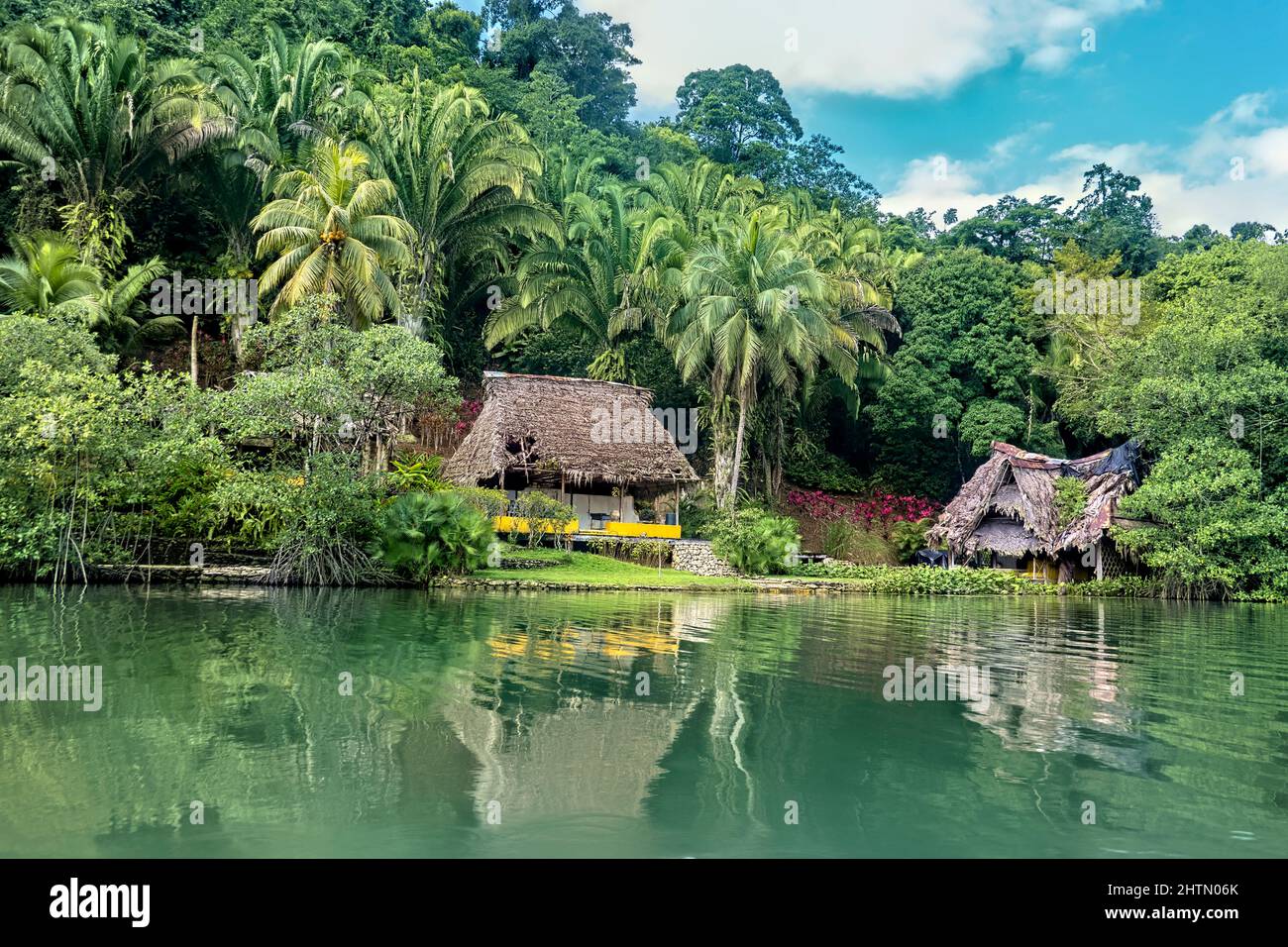 Thatch roof home on the Rio Dulce, Guatemala Stock Photo Alamy