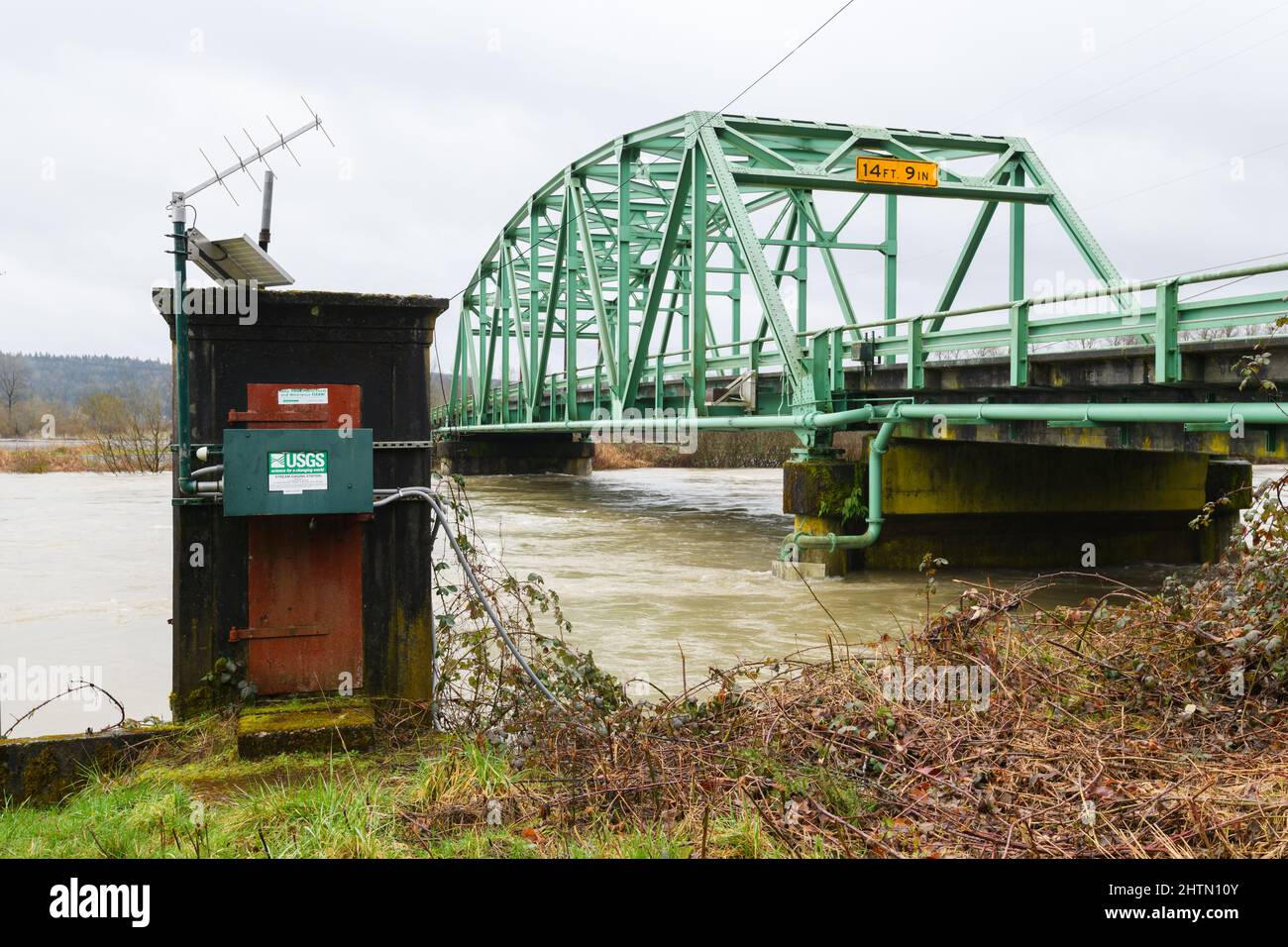 Carnation, WA, USA - March 01, 2022; Snoqualmie River flowing past the USGS Stream Gaging Station in Carnation with river at 57.97 ft and 39,200 cfs Stock Photo