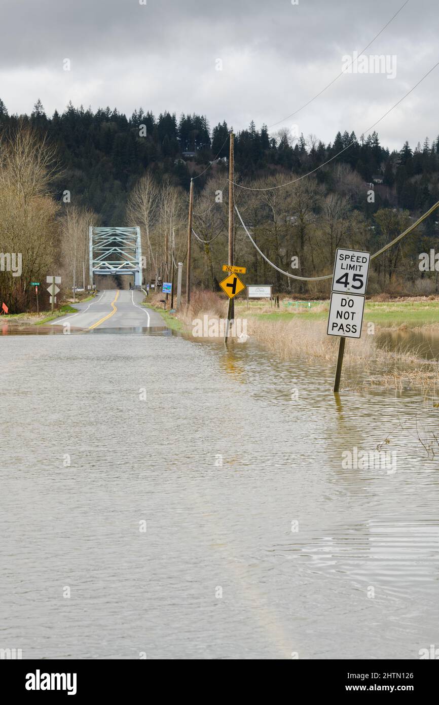 Water submerging NE 124th Street in Duvall Washington after heavy rain and flooding from the