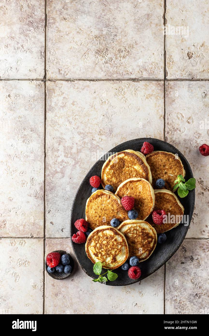 Pancakes Raspberry Blueberries Mint Pancakes in brown ceramic plate with blueberry, raspberry and mint ...
