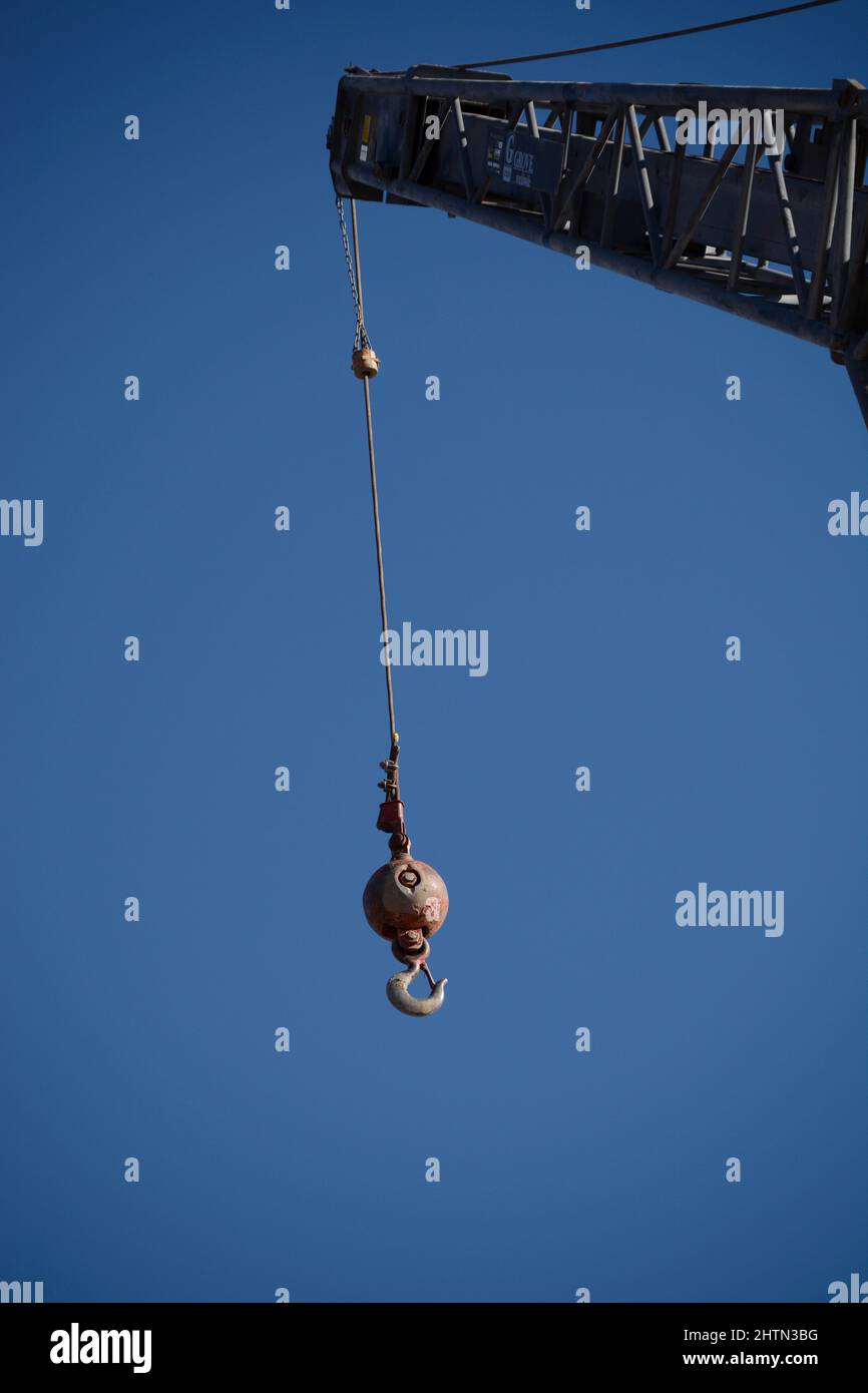 A crane ball hook attached to a crane at a construction site in Santa Fe, New Mexico. Stock Photo