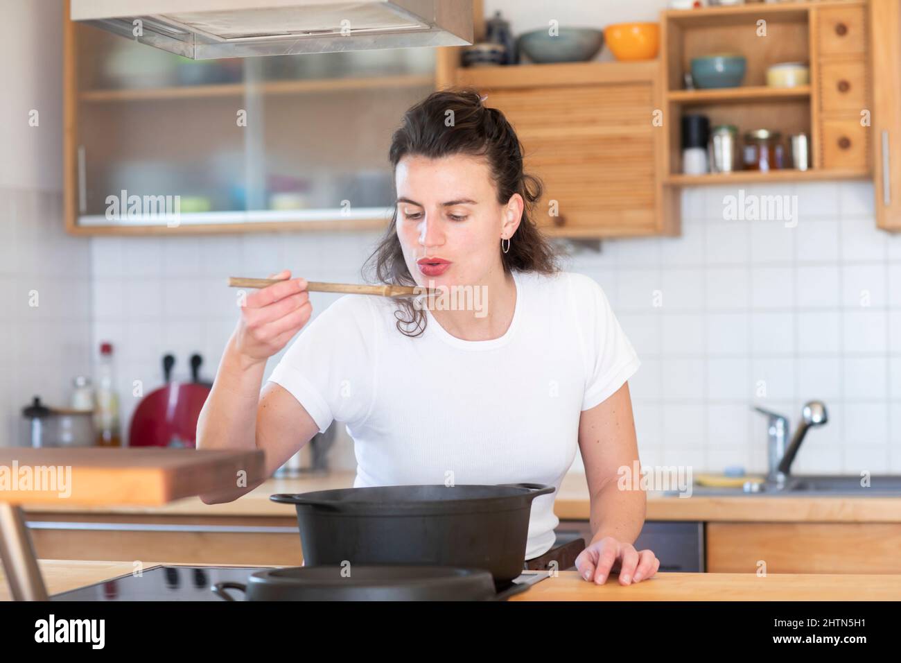 Smiling woman cooking Stock Photo