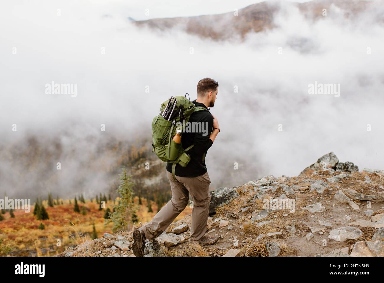 Canada, Whitehorse, Man with backpack hiking in rocky landscape Stock Photo  - Alamy