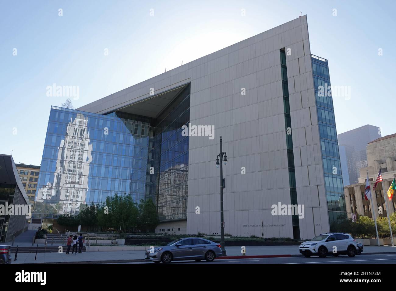Los Angeles, CA / USA - Sept. 23, 2018: The L.A. Police Department headquarters is shown in downtown, with the City Hall building reflecting. Stock Photo