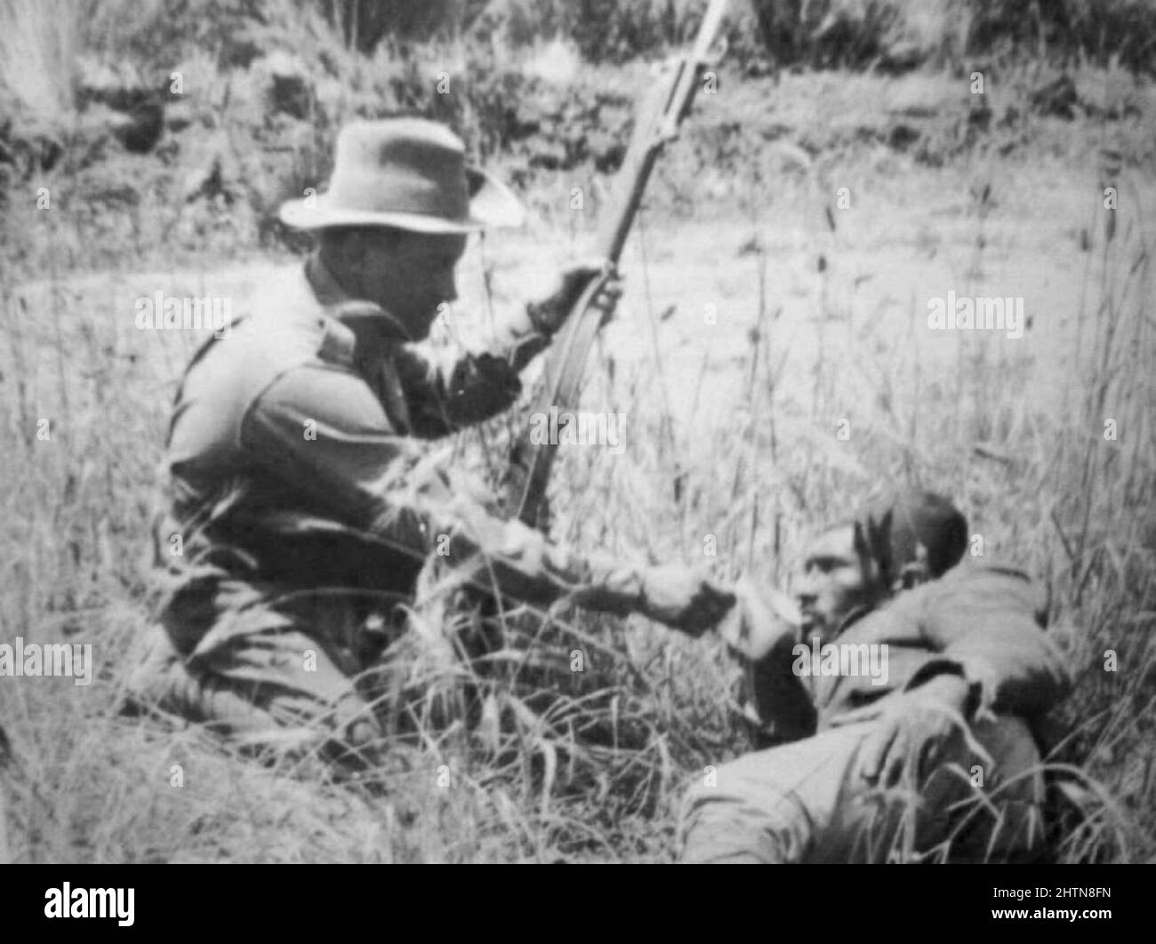 ANZAC soldier giving a wounded Turk a drink during the Gallipoli campaign in WWù Stock Photo