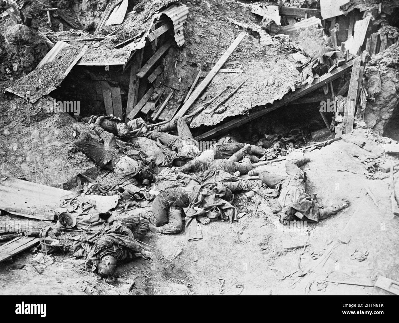 Dead German soldiers scattered in the wreck of a machine gun post near Guillemont. The photograph shows the destruction which occurred when the defence had no deep shelter. Stock Photo