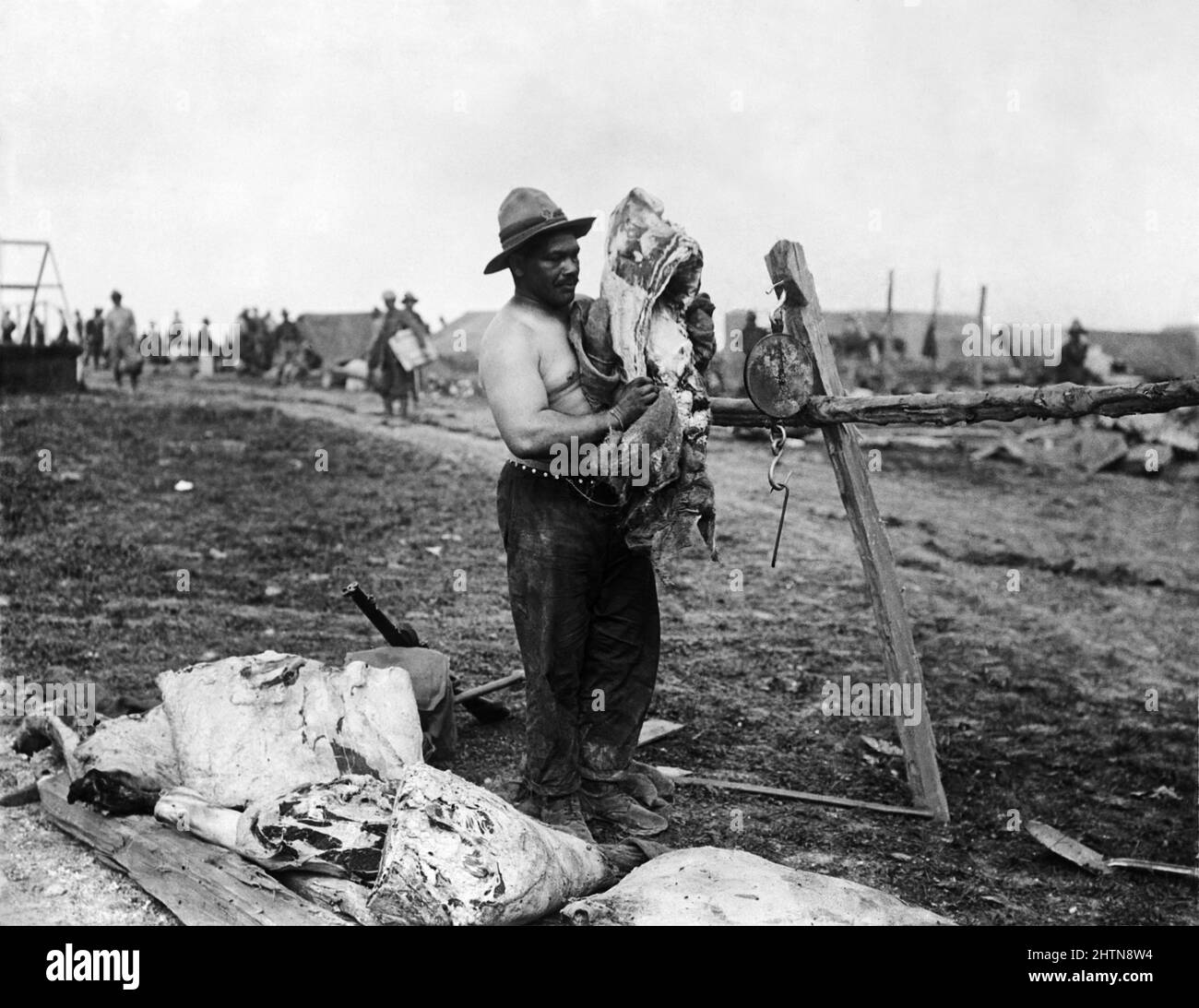 A Maori butcher of the New Zealand Expeditionary Force at work near Fricourt. September 1916 during the Battle of the Somme Stock Photo
