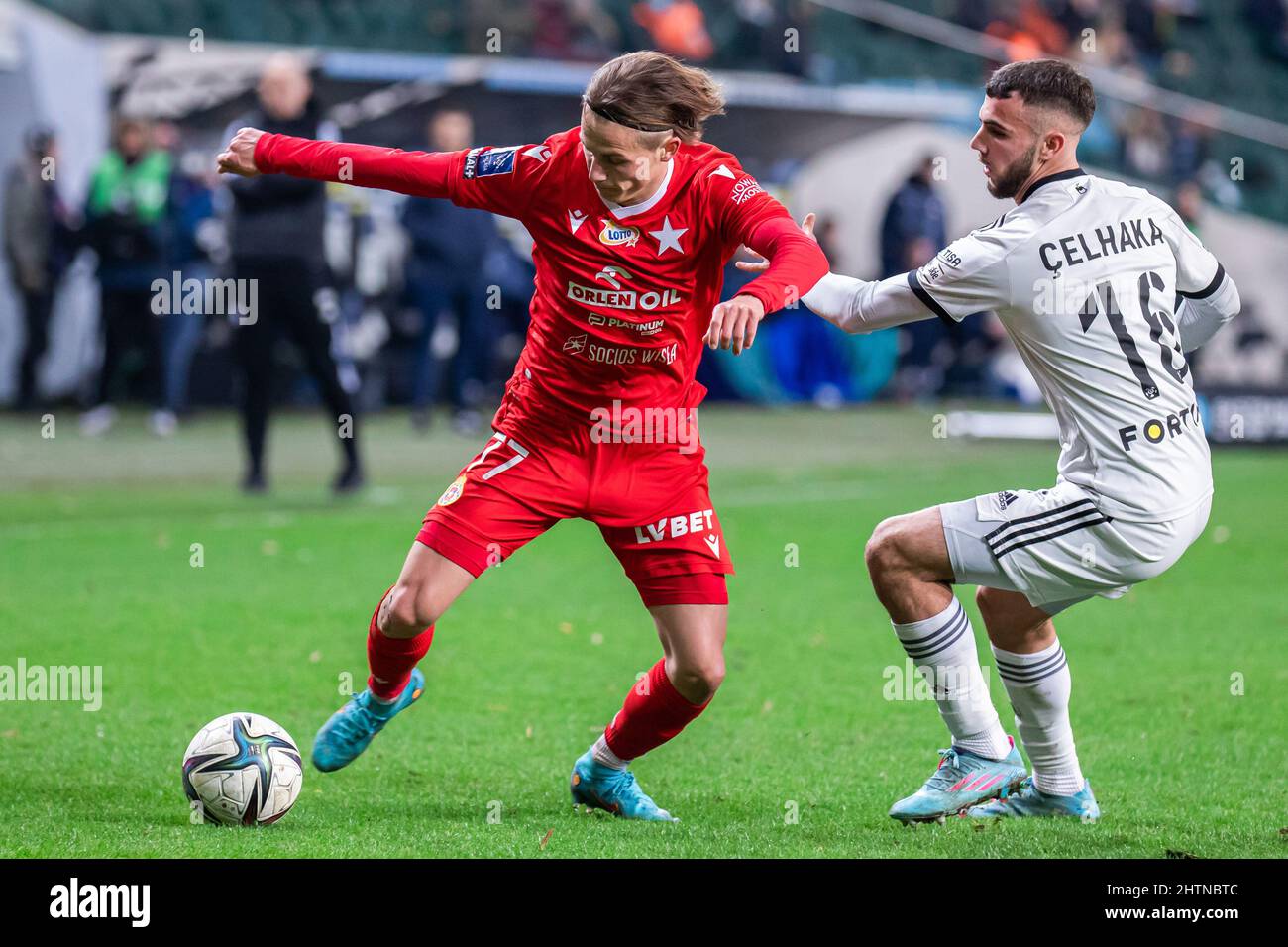 Warsaw, Poland. 25th Feb, 2022. Stefan Savic (L) of Wisla and Jurgen  Celhaka (R) of Legia seen in action during the Polish PKO Ekstraklasa  League match between Legia Warszawa and Wisla Krakow